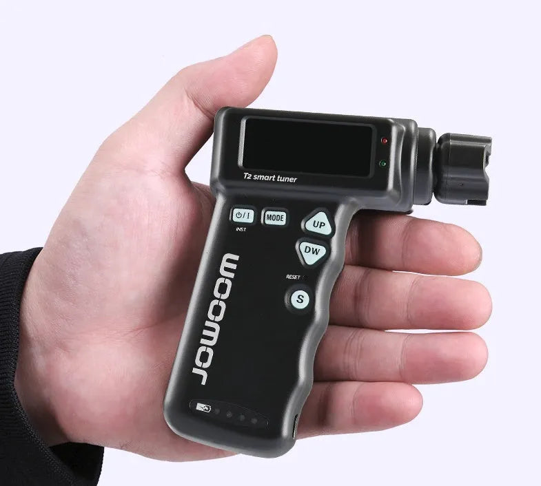 Black and white smart guitar tuner and string winder with colourful LCD display