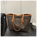 Western style textured PU shoulder bag in black, shown with contrast stitching and an adjustable strap.