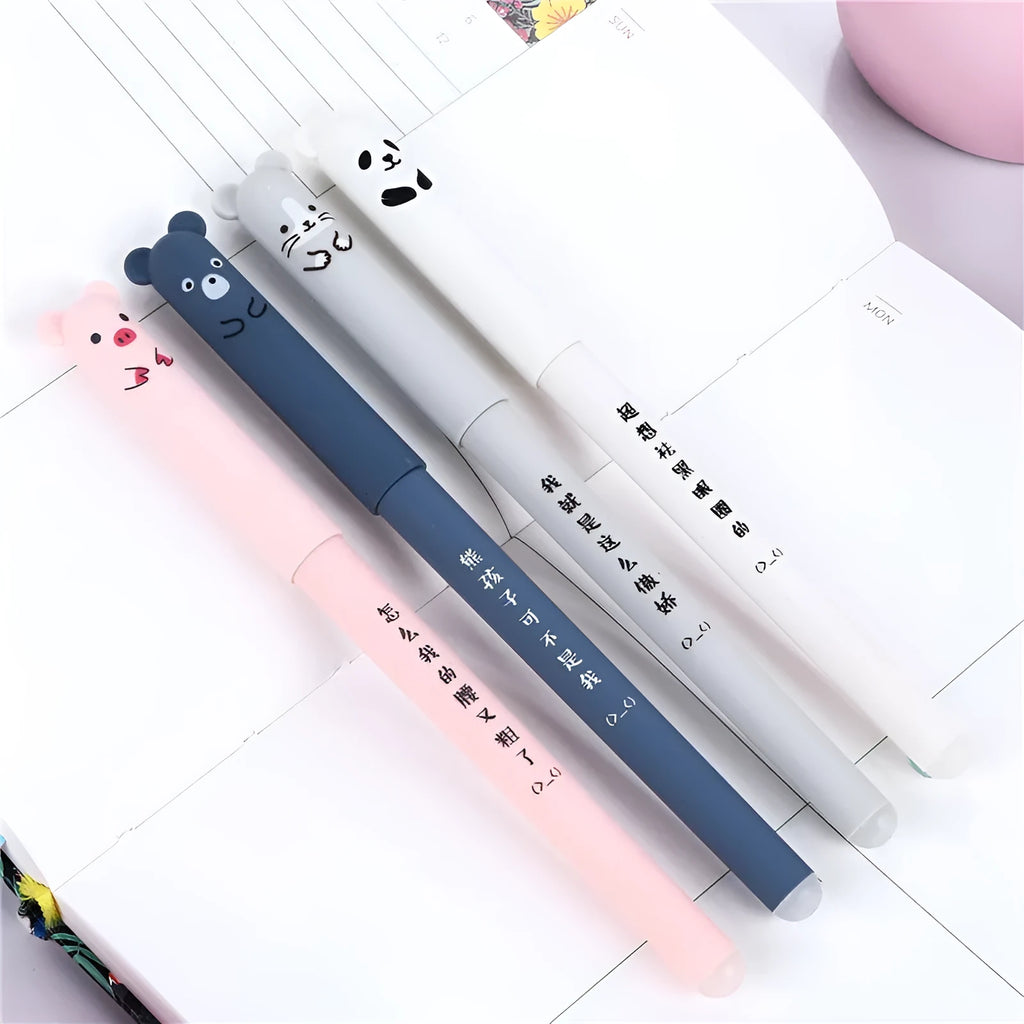 0.5mm hot erasable pen sets in black, blue, and red with refills and nibs on a desk
