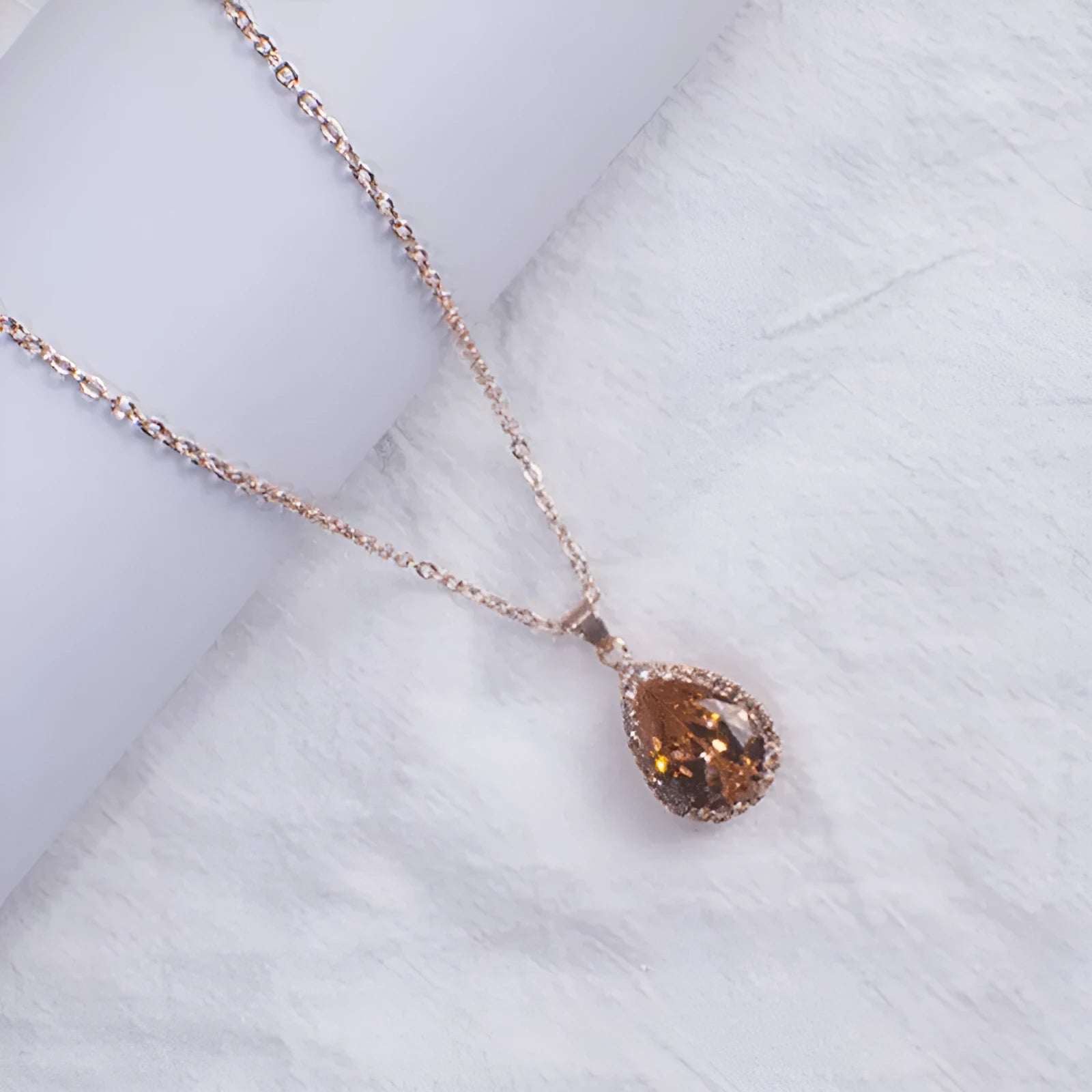 Geometric rhinestone water drop necklace in rose gold electroplated finish