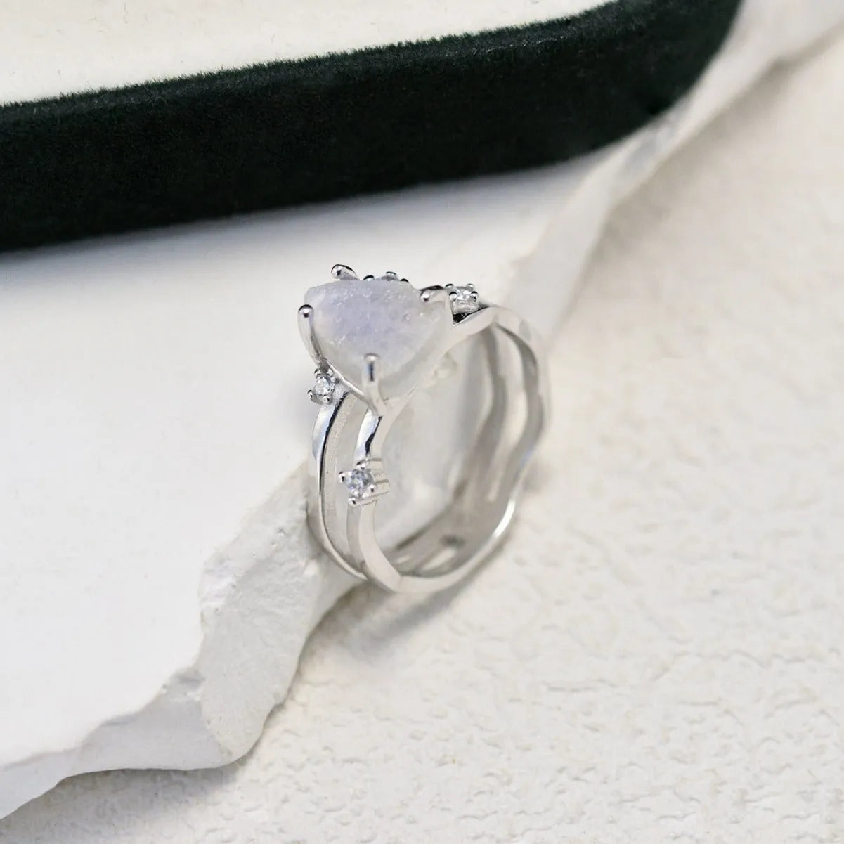 S925 sterling silver geometric ring with an irregular triangle moonstone in a choice of rose gold, white gold, or yellow gold finish.