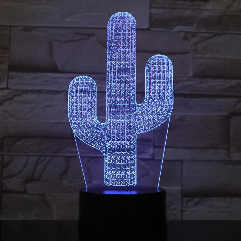 Cactus LED night light with 3D illusion board showing green glow on a table