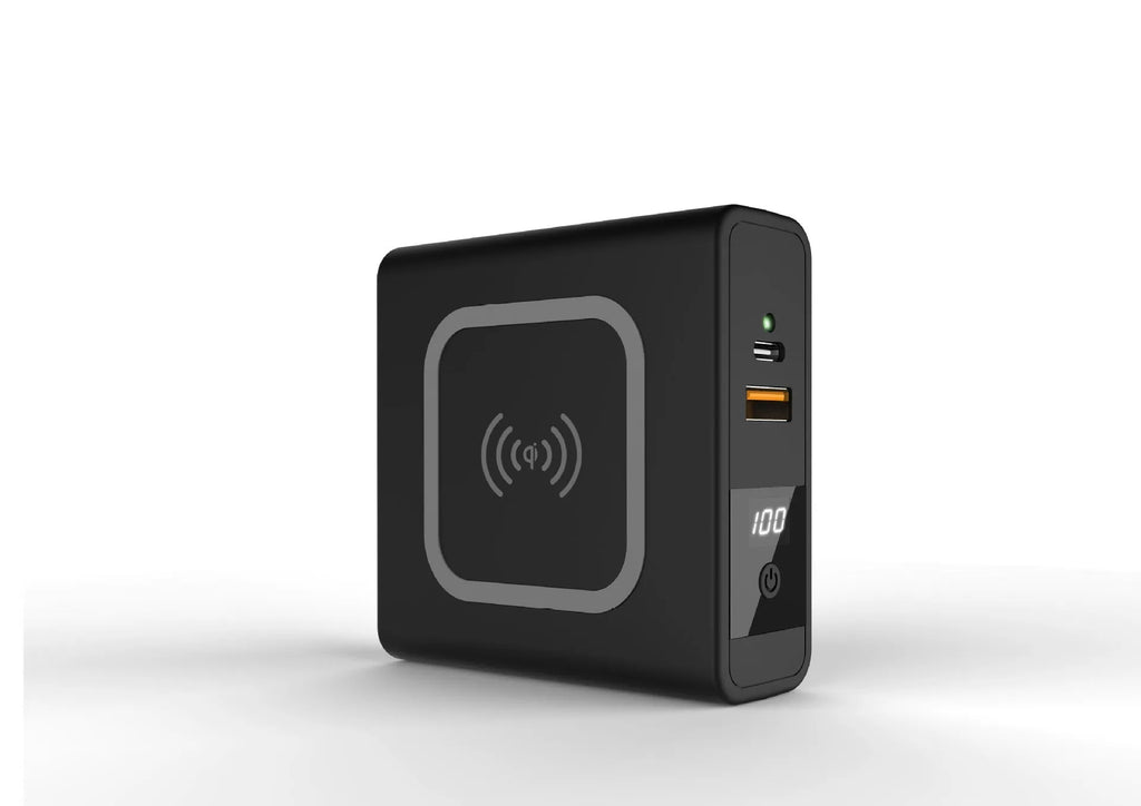 Super Qi wireless power bank in black with folding plug extended and four international adapter heads.