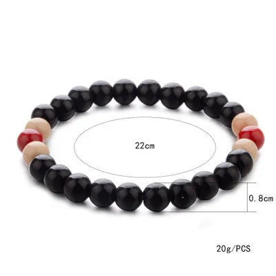 Natural lava stone bead bracelet with ethnic style design on wrist