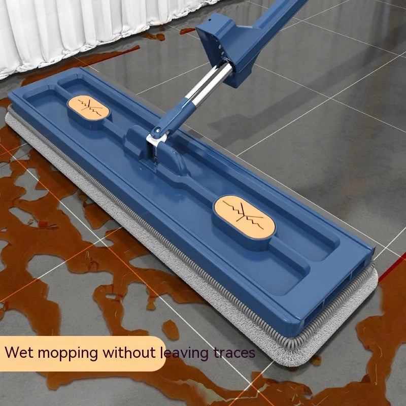 Large flat mop with long stainless steel handle and blue fine fibre mop cloth on a tiled floor
