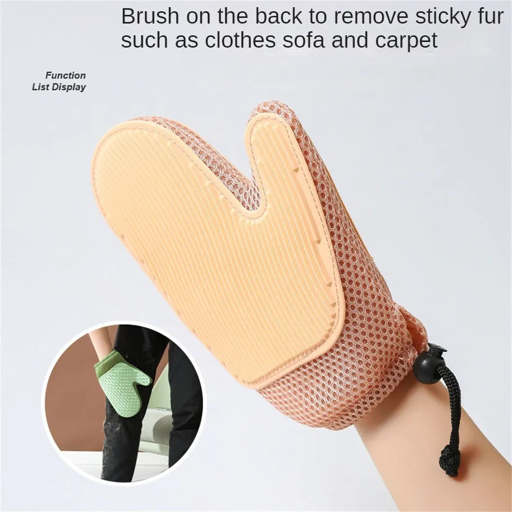 Dark blue pet hair removal glove for cats and dogs on a fabric background
