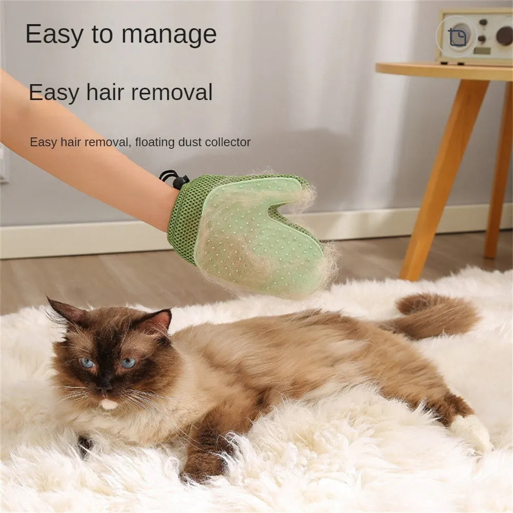 Dark blue pet hair removal glove for cats and dogs on a fabric background