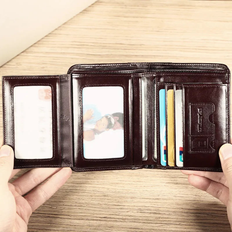 Men's black leather wallet open to show internal card slots, coin pocket, and banknote compartment.