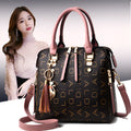 Wild soft PU leather crossbody bag for women with zipper closure and tassel decoration in solid colour