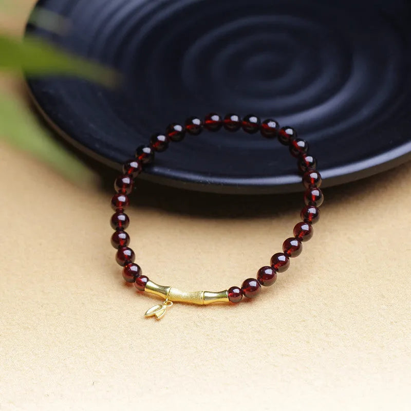 Single ring bamboo joint bracelet with 6mm natural garnet bead in copper or silver finish