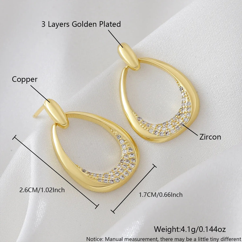 Women's geometric drop-shaped earrings in yellow gold with round and oval elements