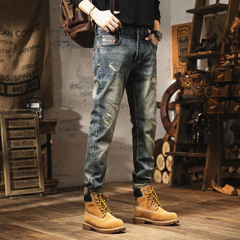 Man wearing vintage blue loose-fit jeans with a fleece lining and drawstring waist.
