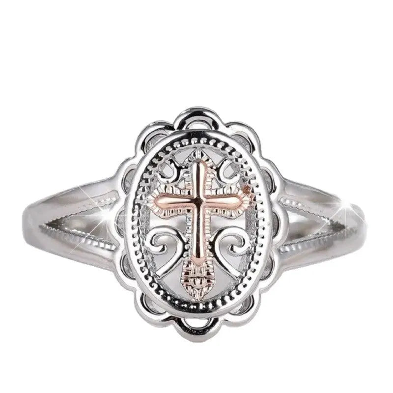 Silver cross and lace patterned alloy ring for women on a white background.
