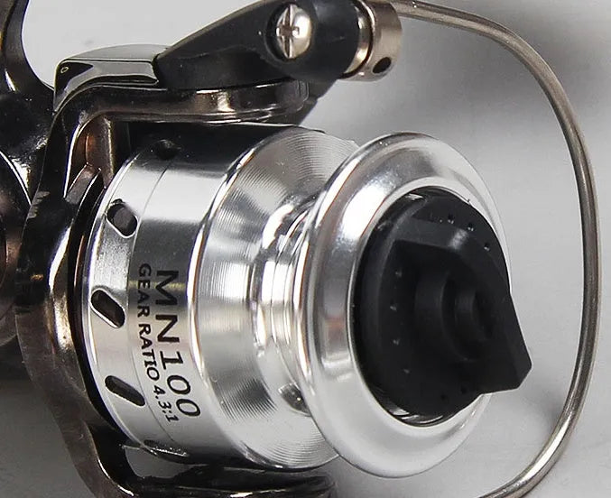 Mini 100 all metal fishing reel in black colour with folding rocker arm and wooden handle