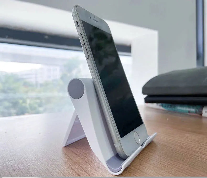 Black PE folding tablet stand holding mobile phone at adjustable angle