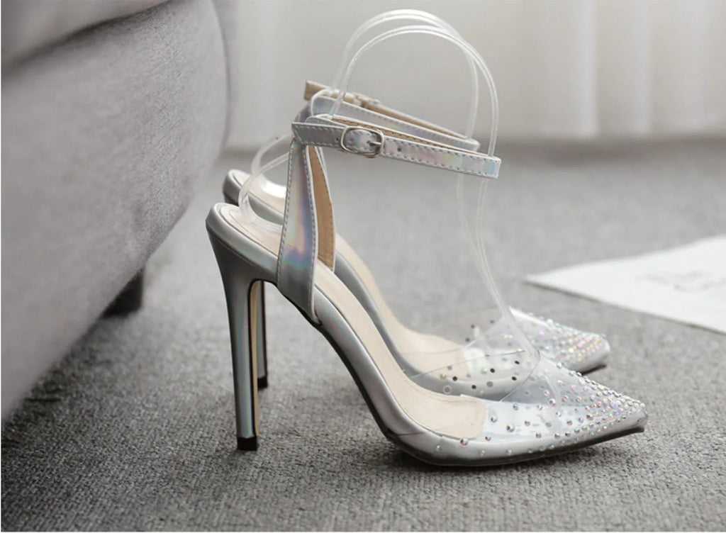 Gold glitter pointed toe stiletto sandals for women on a white background