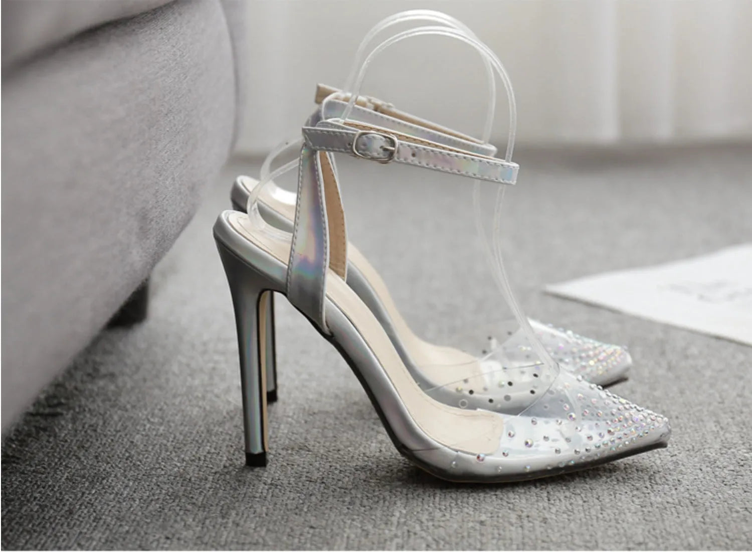 Gold glitter pointed toe stiletto sandals for women on a white background