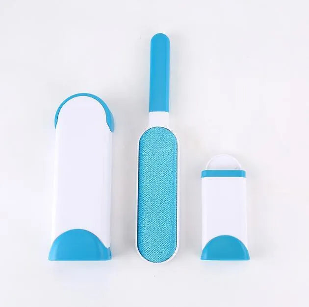 Blue reusable pet hair removal comb with double-sided sticky brush next to its self-cleaning base.