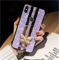 Luxury acrylic iPhone case with butterfly and diamond crystal design and a mirrored back in purple colour.