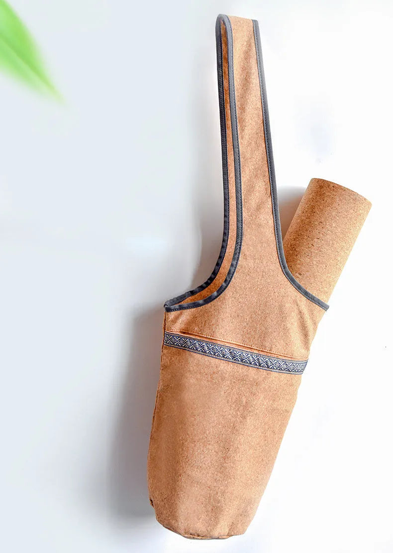 Cork yoga backpack with bohemian style, wide shoulder straps, and multiple pockets for mat, water bottle, and accessories.