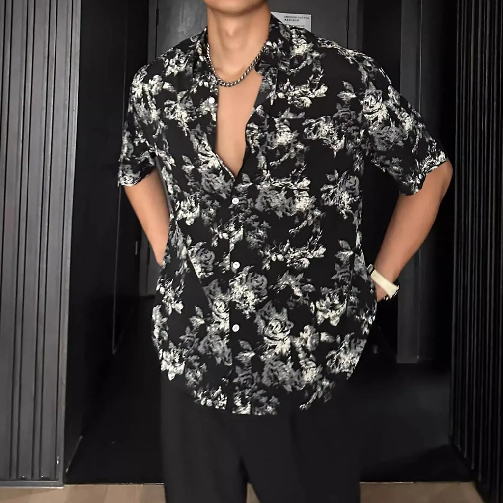 Loose black and white floral print short sleeve casual shirt for women on a hanger