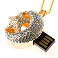 Creative jewellery-inspired metal USB flash drive on a plain background.