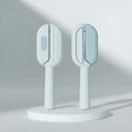 Blue pet comb with water tank for removing floating hair from dogs and cats.