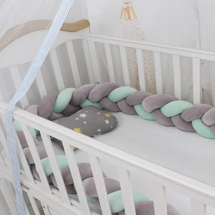 Spandex crystal velvet baby cot bumper in grey pink colour, shown flexible and long.