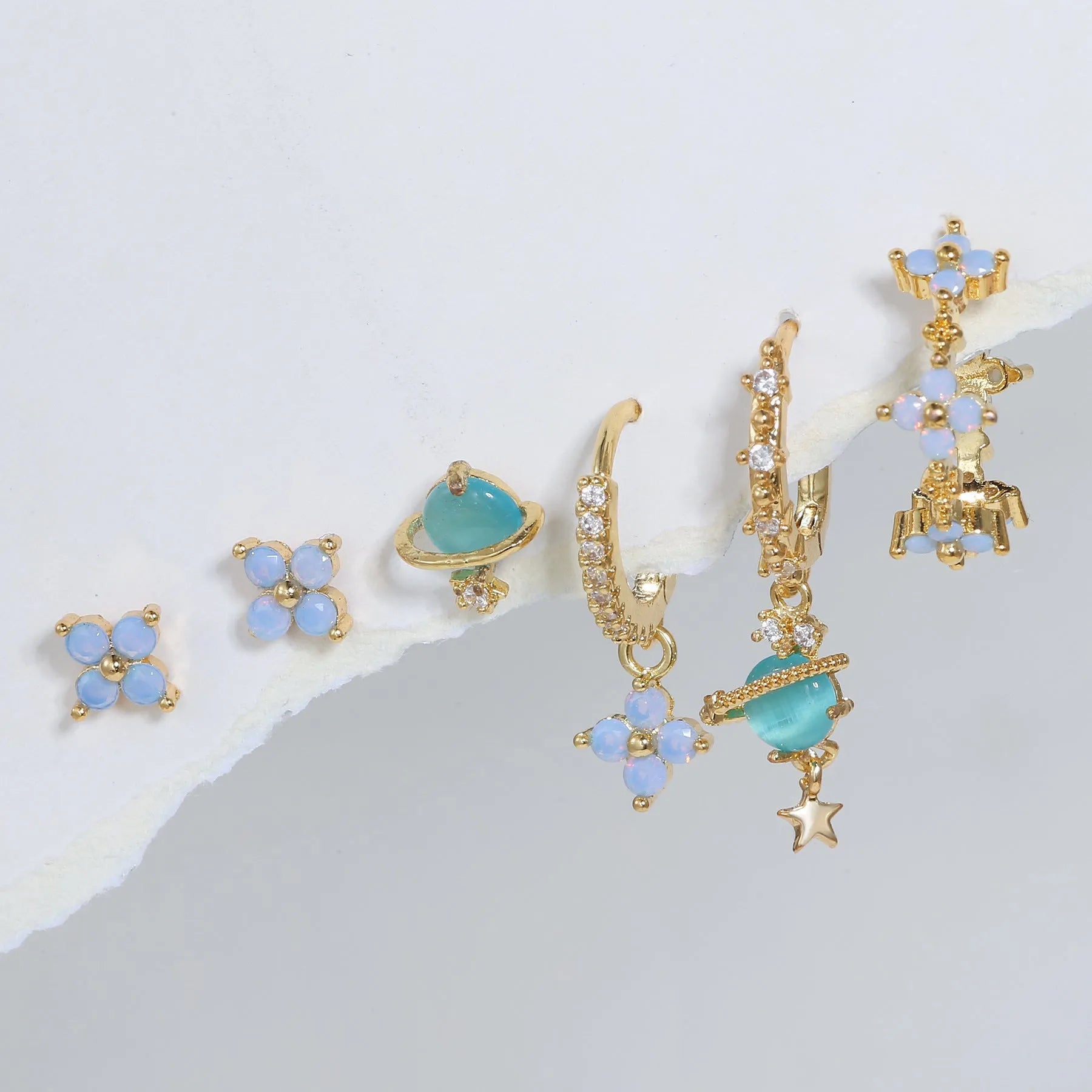 Gold and silver floral stud earrings with zircon detail in a Japanese Korean sweet girl style.