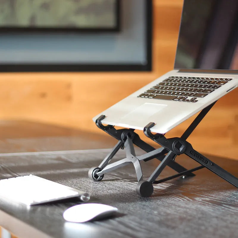 Black folding portable laptop stand made of reinforced nylon with compact folded dimensions