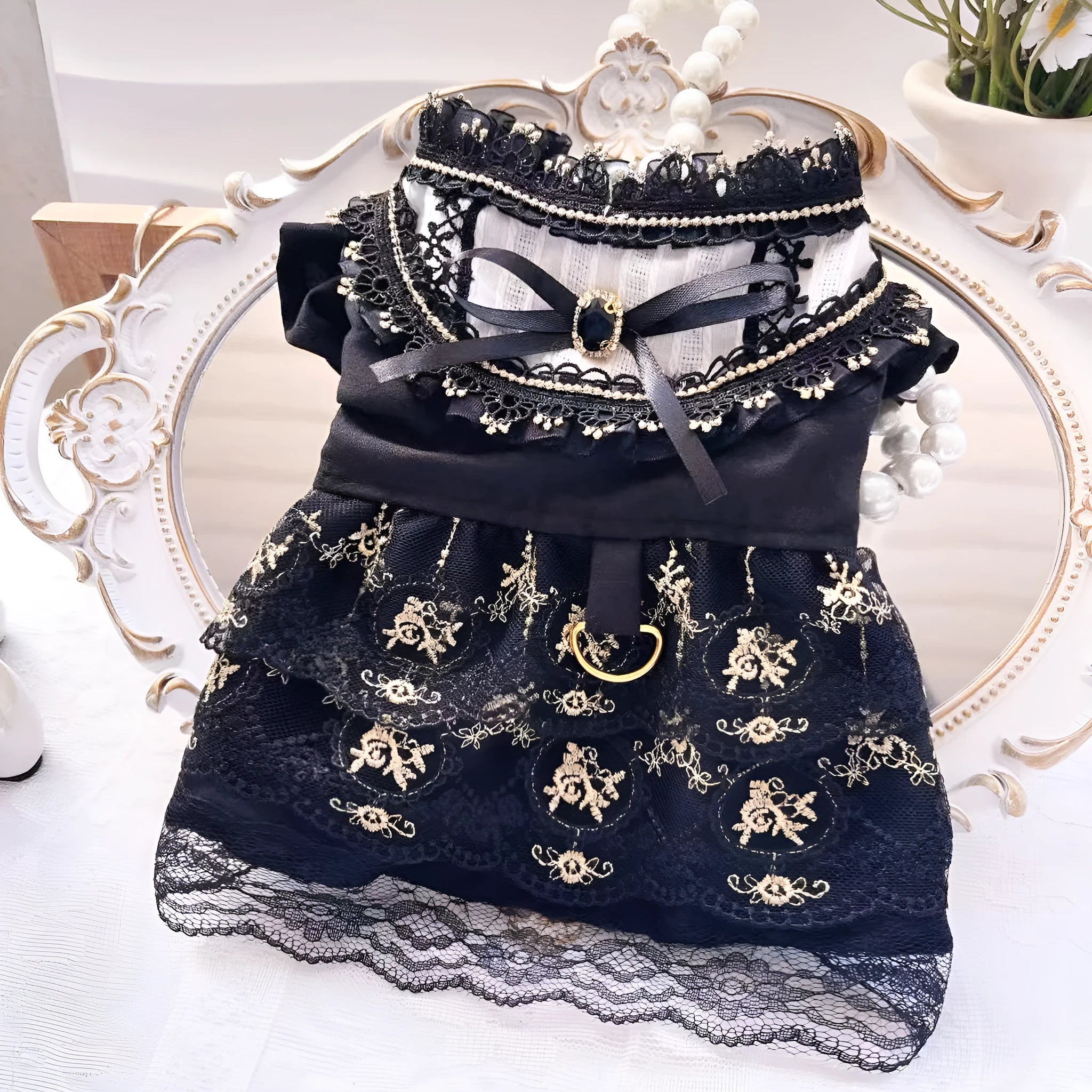Golden gothic style skirt costume for a small dog or cat on a hanger.