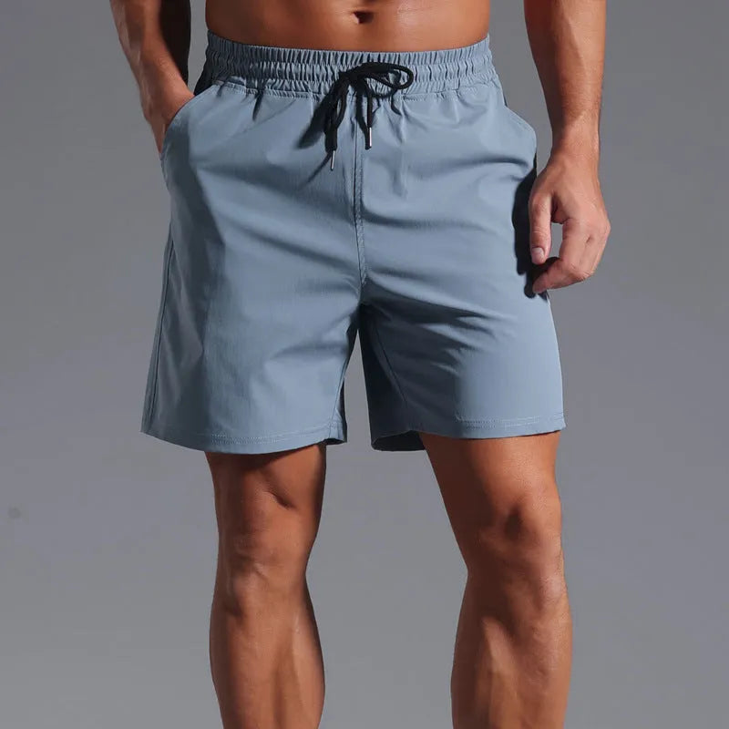Men's loose-fit casual shorts in quick-dry polyester, shown in black, blue, khaki, or purplish red.