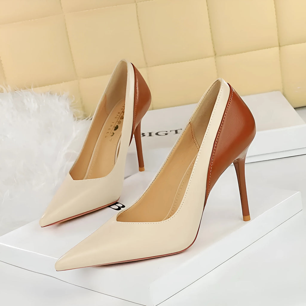 Retro black and creamy-white women's stiletto heels with pointed toe and high thin heel for banquet events.