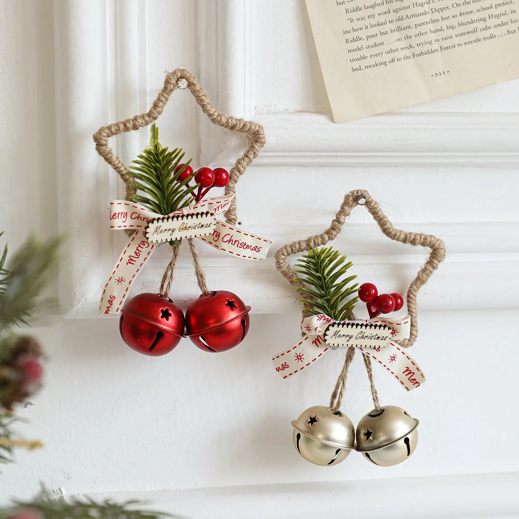 Iron Christmas bell ornament in gold hanging on a Christmas tree branch