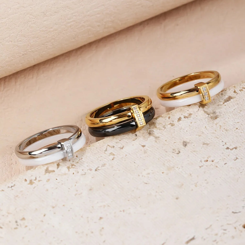 Women's titanium steel heart-shaped double ring with glossy stitching and inlaid zirconium detail.