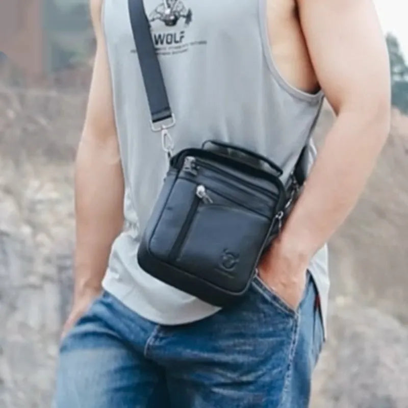 Men's black genuine leather shoulder messenger bag with solid colour finish and retro European American style for leisure travel