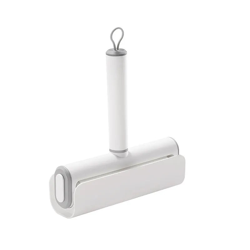 Long-handle lint roller with removable adhesive head for picking up pet hair from floors and furniture