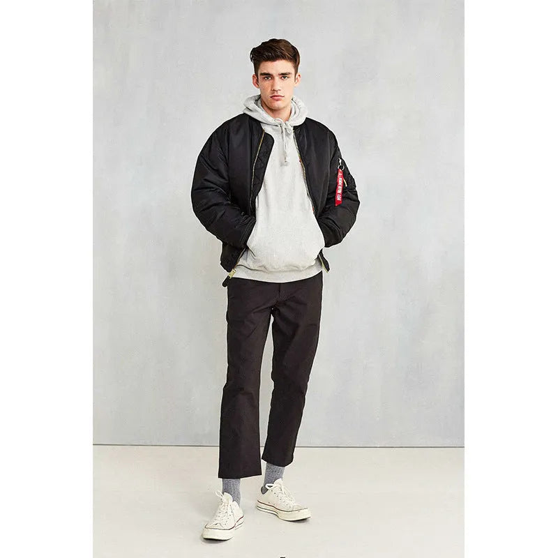 Men's army green loose fit cotton-padded pilot jacket with a double-sided construction on a hanger.