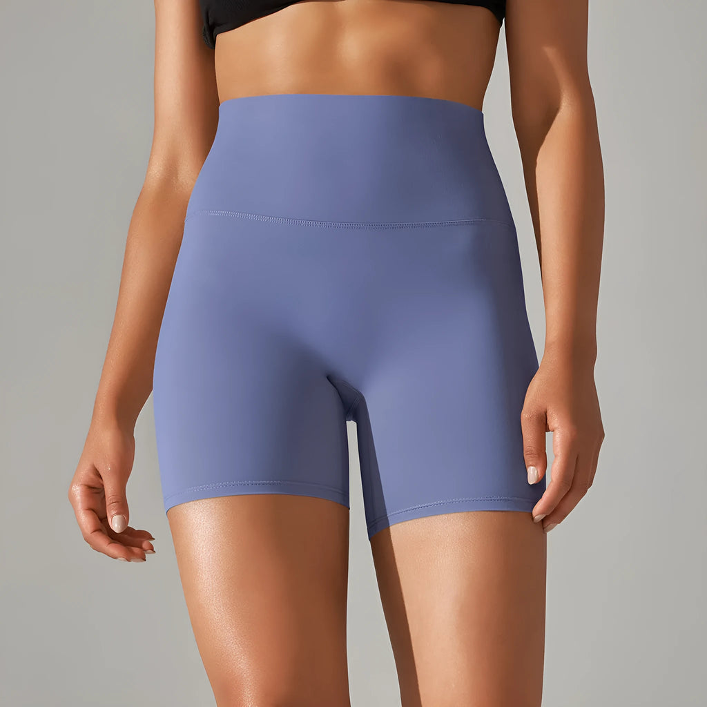 Women's high waist fitness tights in dark green, hip-length cut, for running and gym wear.