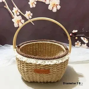 Small hand-woven straw storage basket in brown, measuring 19cm wide.