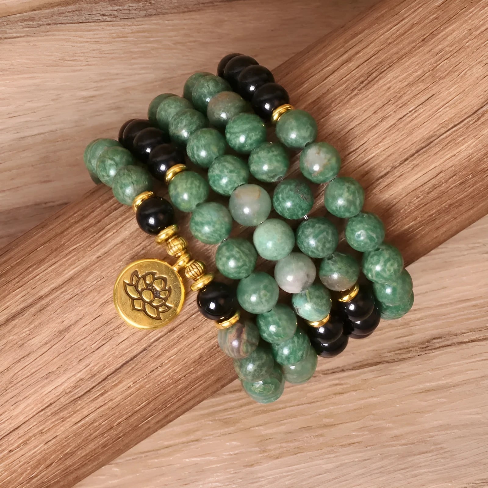 Green and black elastic beaded bracelet with alloy construction