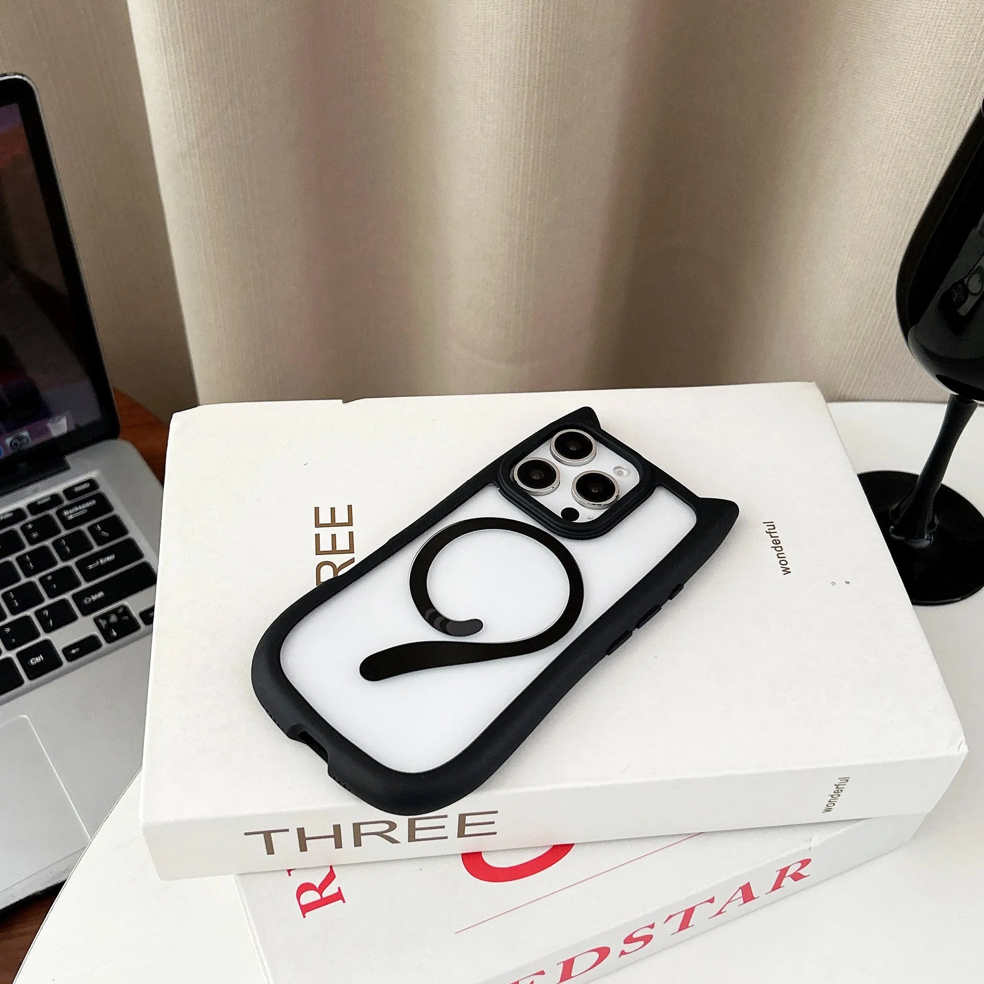 Transparent acrylic and TPU phone case for iPhone 17 models in black, blue, grey, and pink colour options.