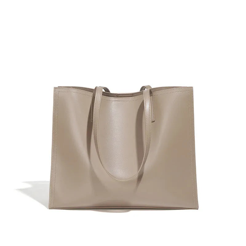 Genuine leather women's one shoulder handbag in a horizontal square shape showing internal compartments.