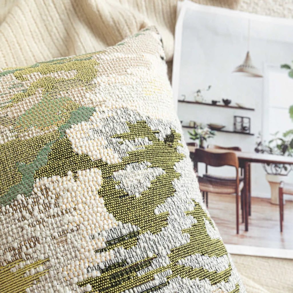 Antique green wool blended pillowcase with abstract spring flowers pattern, shown in square and bolster sizes.