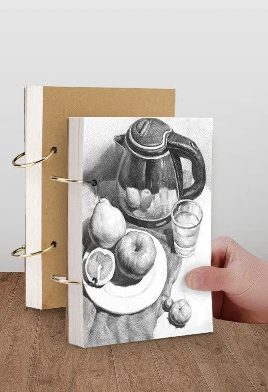 8K thickened sketchbook open showing coil binding and marker illustration on specialised paper