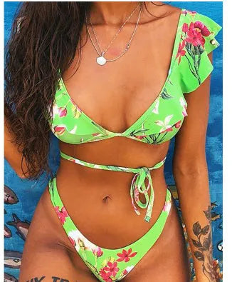 Yellow floral print split bikini swimsuit set with top and pants on a mannequin