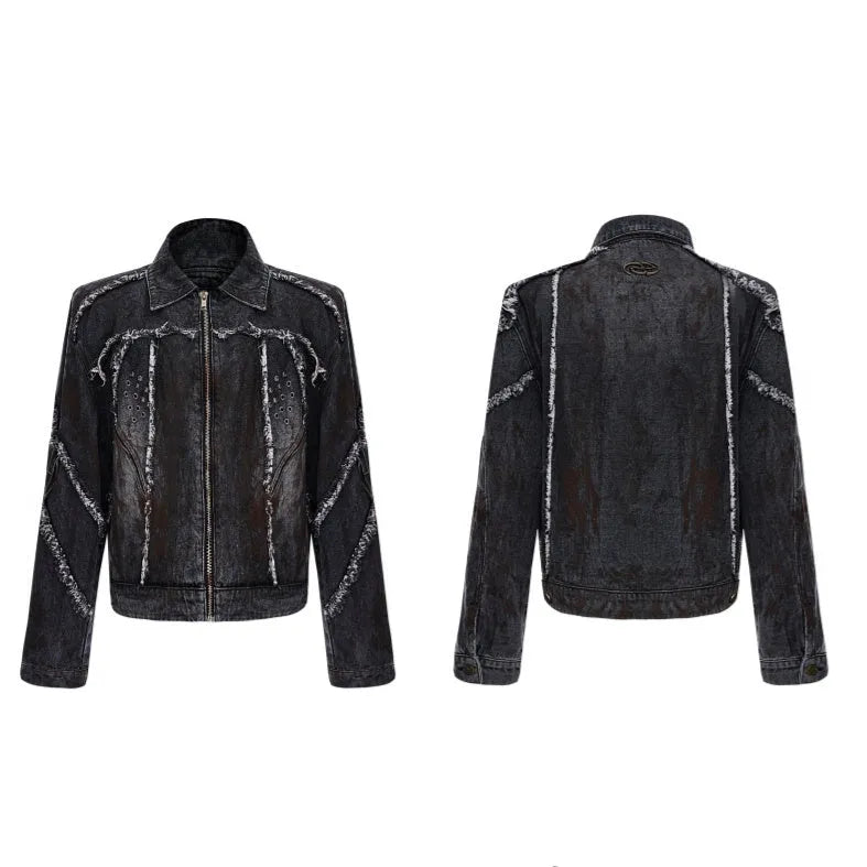Black distressed raw-edge denim coat with padded shoulders and splash-dye gradient, paired with matching black pants.