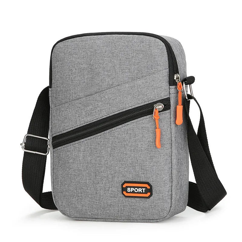 Solid colour Oxford cloth commuter bag with contrast stitching, shown with crossbody strap.