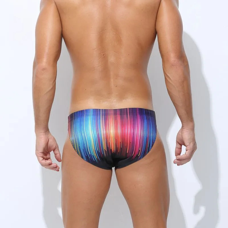 Adult men's printed swimming trunks in polyester, showing pattern options for swimming.