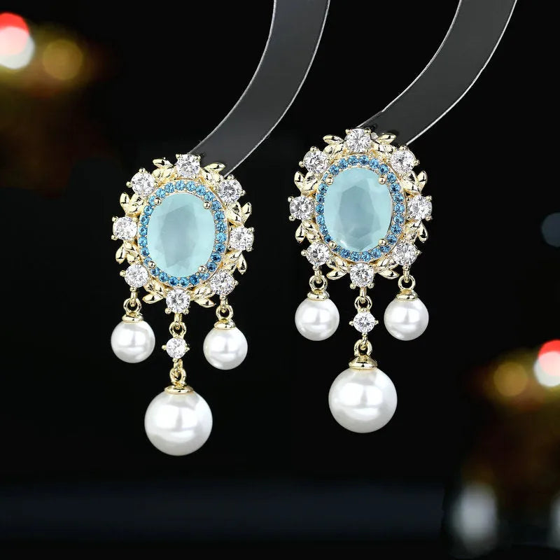 Oval geometric earrings with zircon inlaid details and pearl-accented tassel drop in light purple